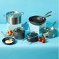 Cookware refers to pots, pans, and other cooking vessels used for preparing food on stovetops or ovens.